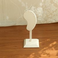 Ear shaped earring hold...