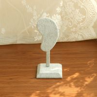 Ear shaped earring hold...