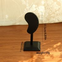 Ear shaped earring hold...